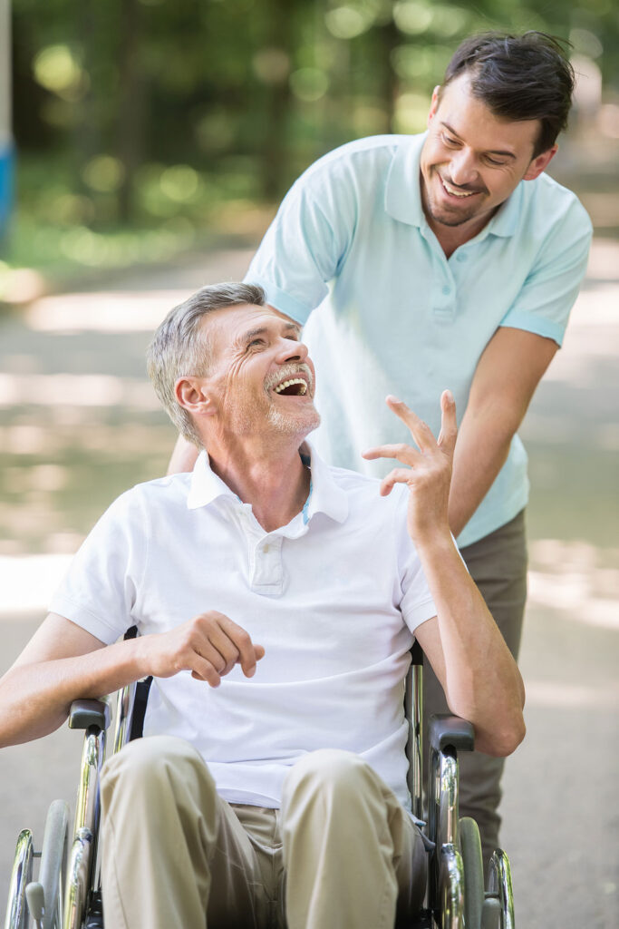 Elderly man on a stroll with caregiver