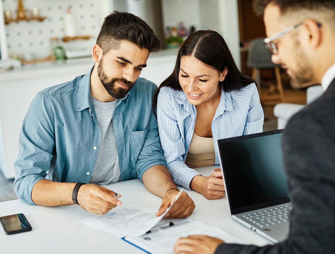 A man and a woman looking at paperwork