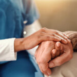 Two people holding hands