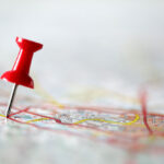 A pushpin on a map