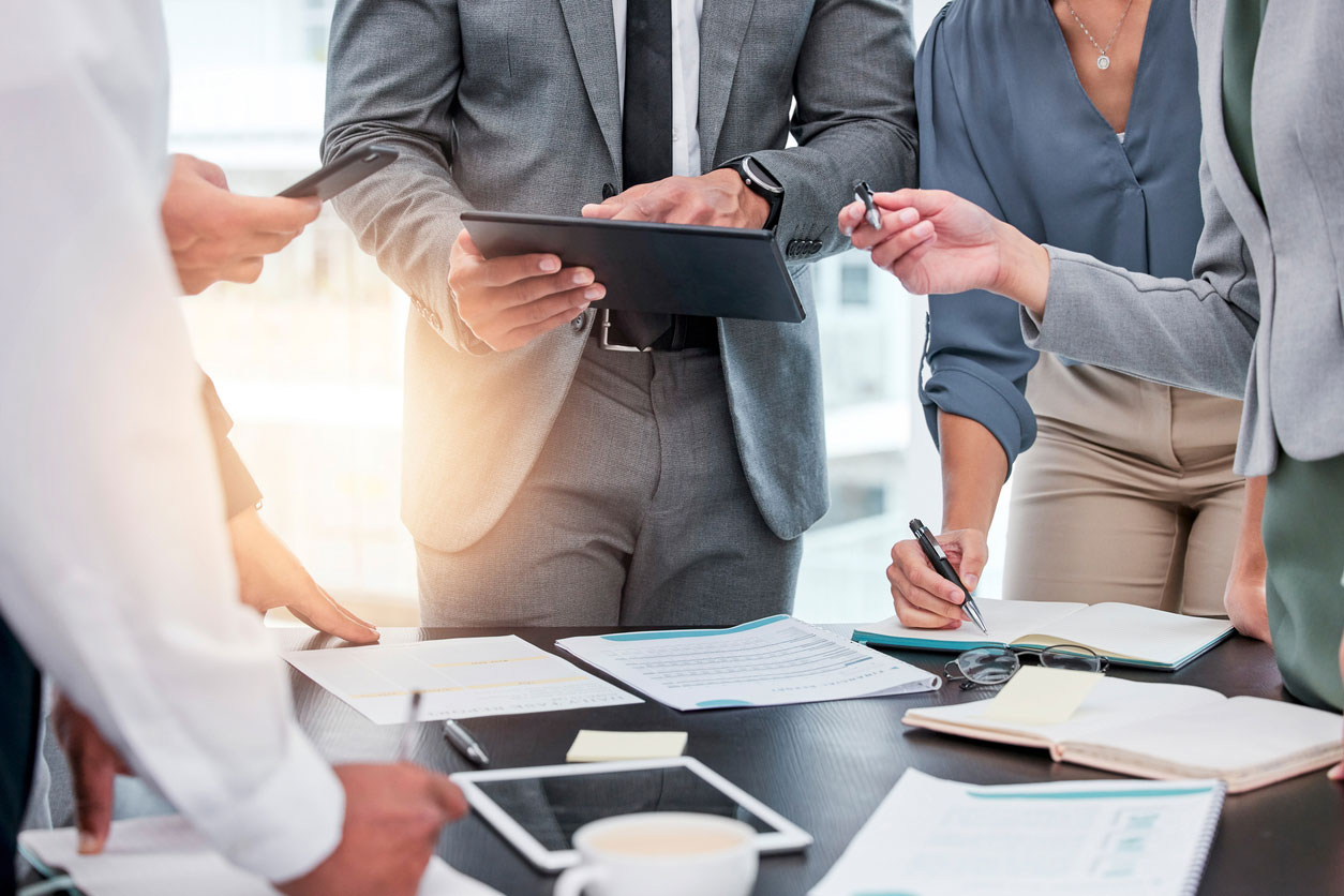 People standing around a desk working