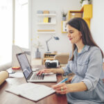 Lady Working at home on her computer