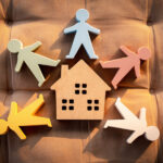 Illustration of a home surrounded by people, symbolizing family support and in-home care services