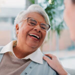 An elderly woman smiling