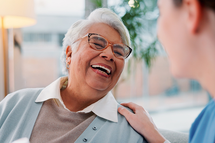 An elderly woman smiling