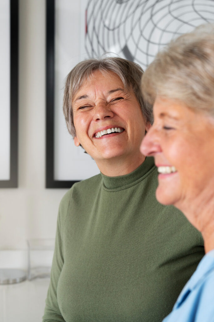 Elderly women laughing