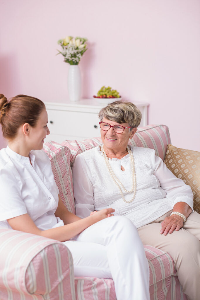 A Place At Home Caregiver with Happy Elderly Woman