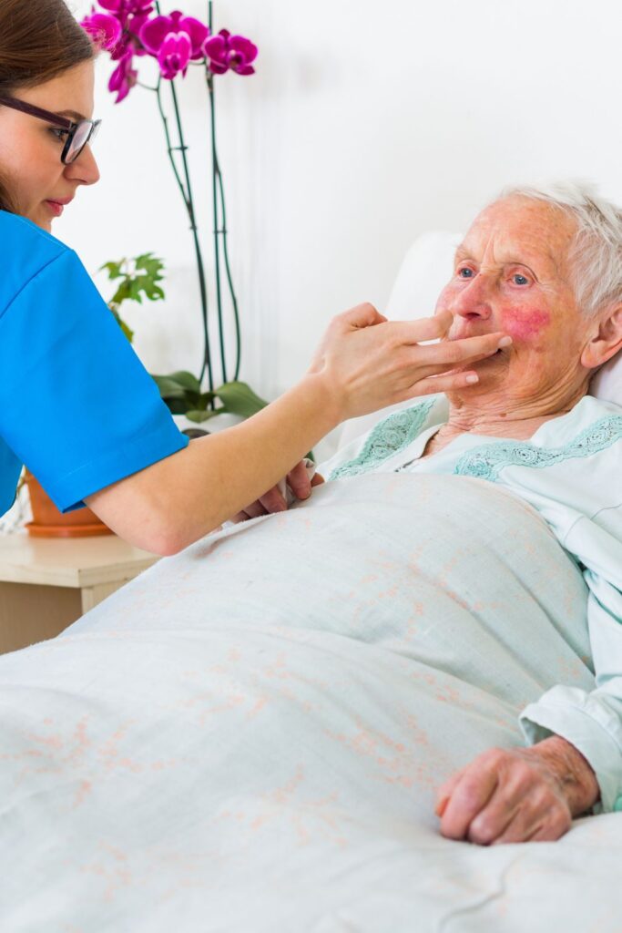 Caregiver reminding a senior woman to take her medication in Los Alamitos, CA