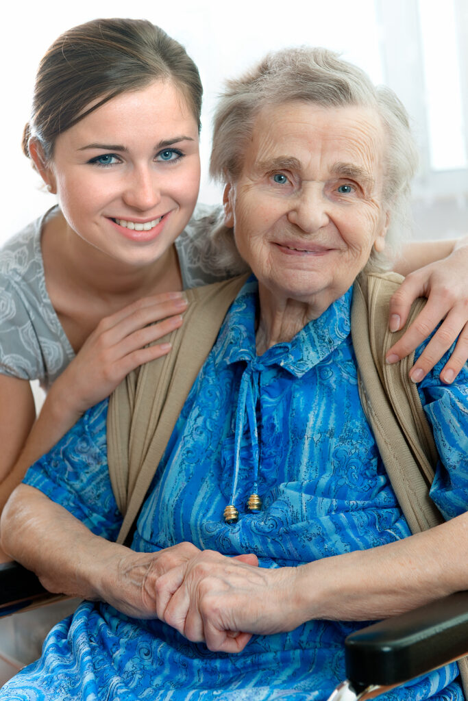 Personal and companion caregiver hugging a senior woman in Los Alamitos, CA