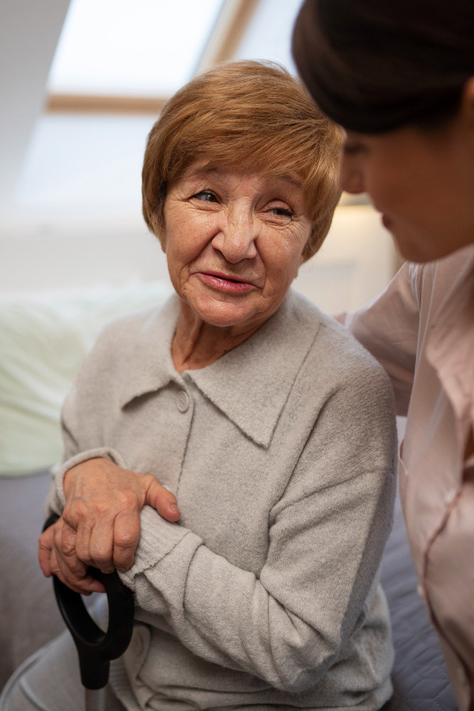 happy elderly woman talking to her caregiver