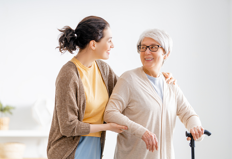 caregiver and elderly woman having a conversation