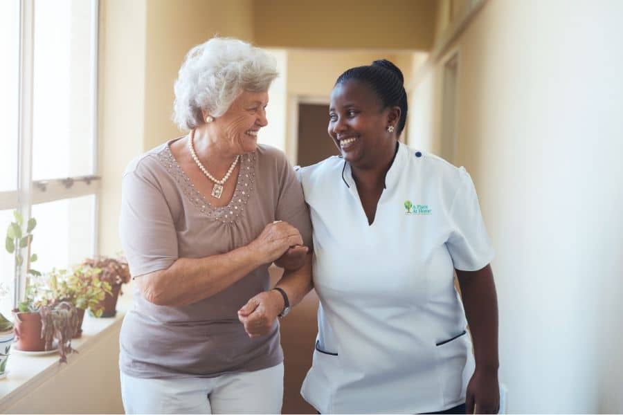 Caregiver giving companionship to senior woman