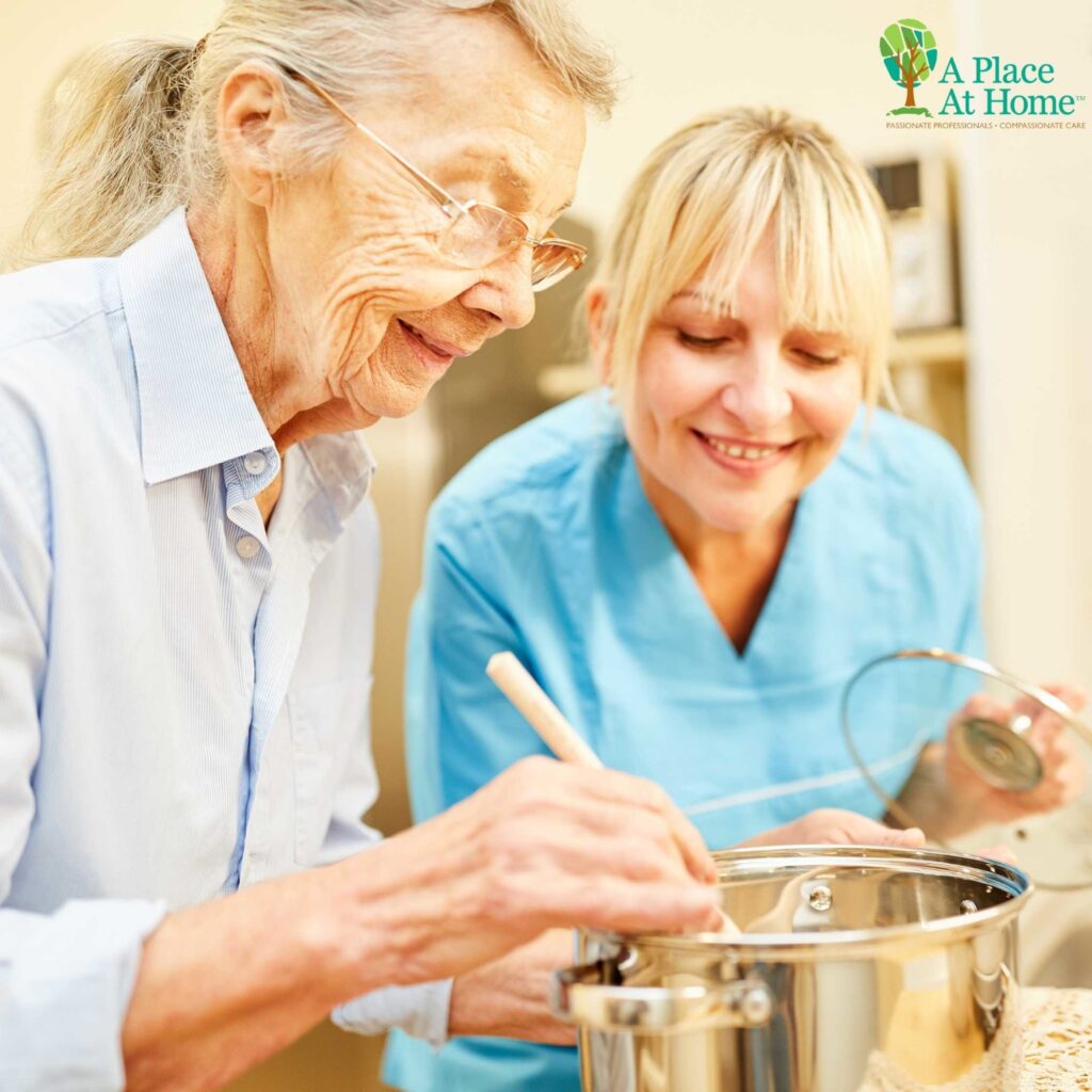 caregiver providing companionship to elder woman at home