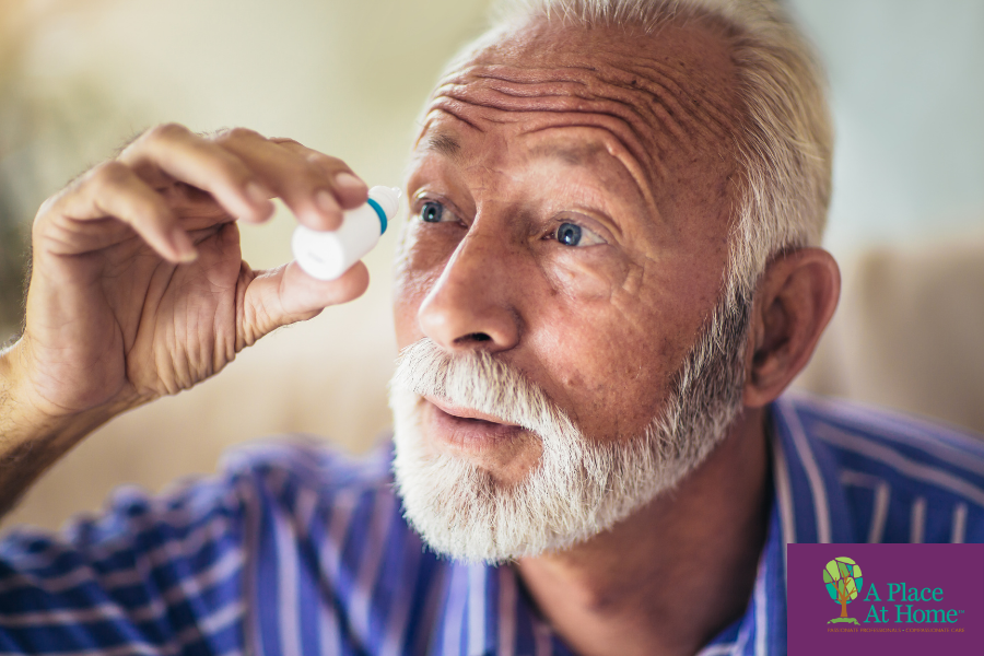 Elderly man using preservative-free artificial tears
