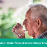 senior man drinking a glass of water for hydration