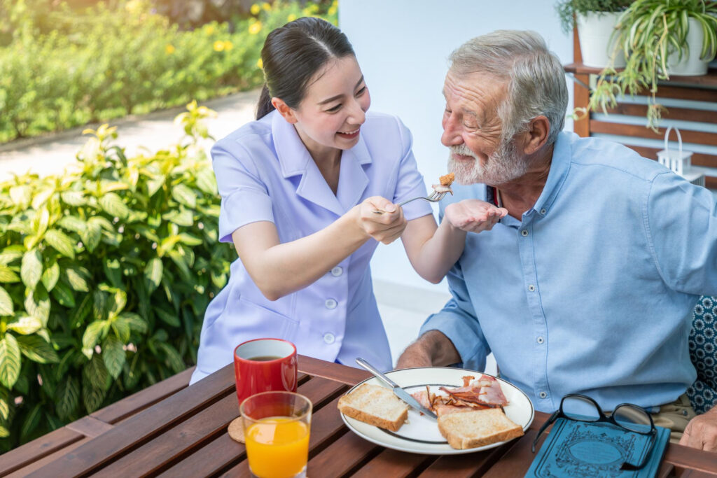 Happy Elderly man and caregiver