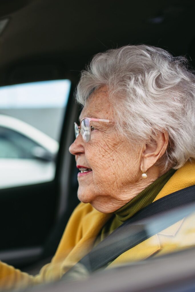 Senior woman struggling to drive her car to her appointment