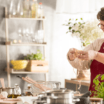 Senior woman cooking healthy meal Nutritional needs as we age