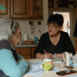 Two women discuss with eachother